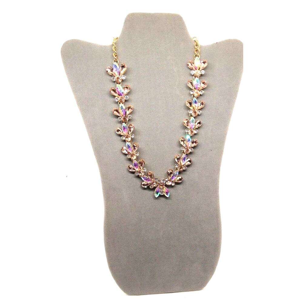 Statement necklace with clear, AB, peach crystals/rhinestones, gold tone.